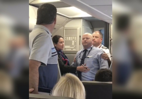 American Airlines Flight Attendant Challenges Passenger To Fight, 